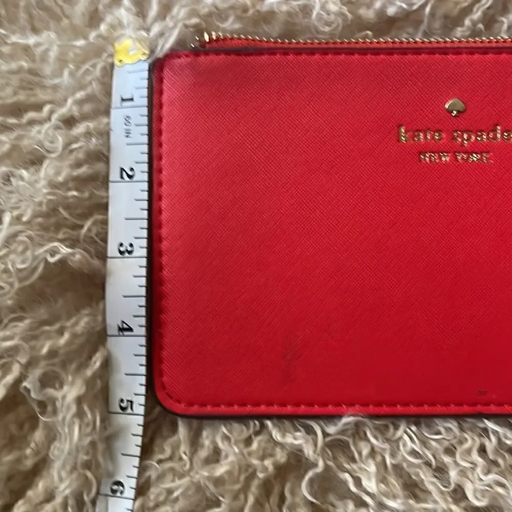 Kate Spade ORANGE MEDIUM ZIP WRISTLET